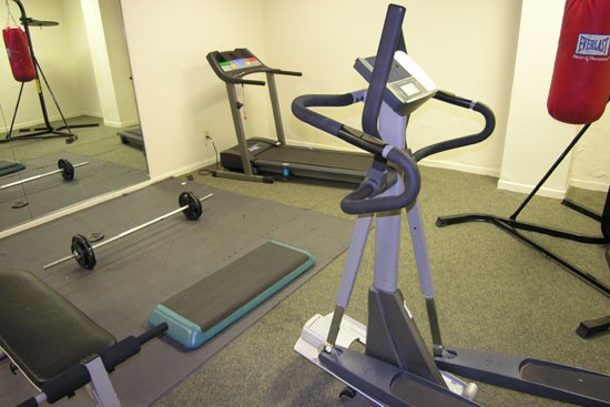Fairmont Fitness room with weight bar and treadmill